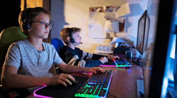 Kids playing online on computers.
