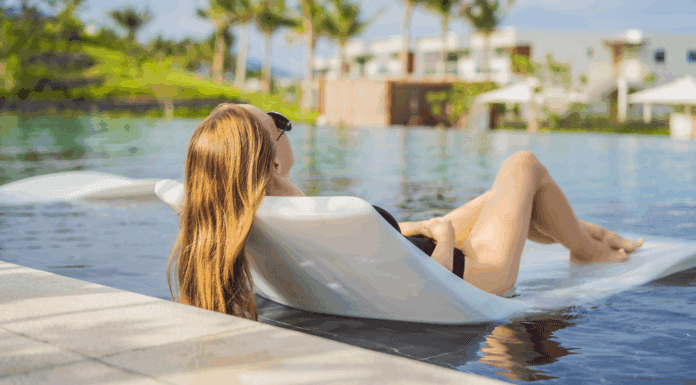Finally, a Real Vacation A woman lounging on a raft in a pool finally having a real vacation.