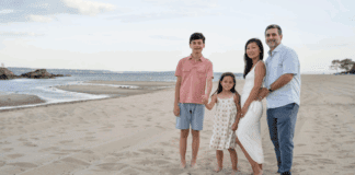 Contributor Anne and her family posing on the beach.
