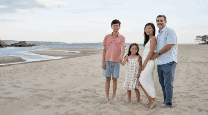 Contributor Anne and her family posing on the beach.