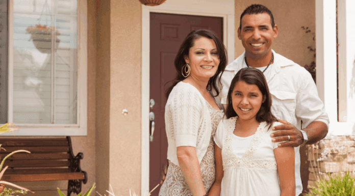 National Hispanic Heritage Month: A Hispanic Mom’s Reflection A Hispanic family in front of their house.