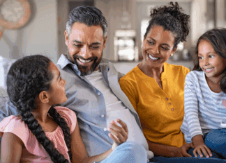 Breaking the Cycle A loving family sitting together.