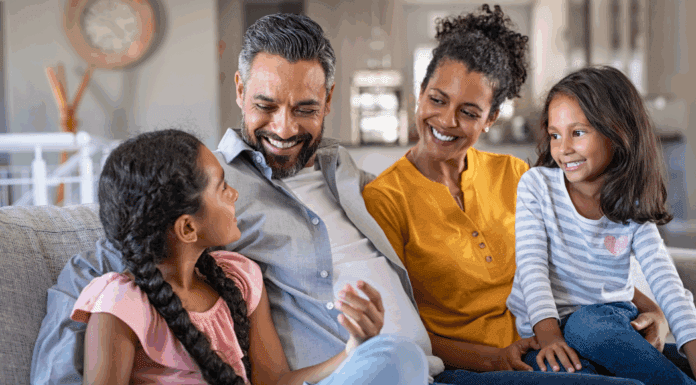Breaking the Cycle A loving family sitting together.