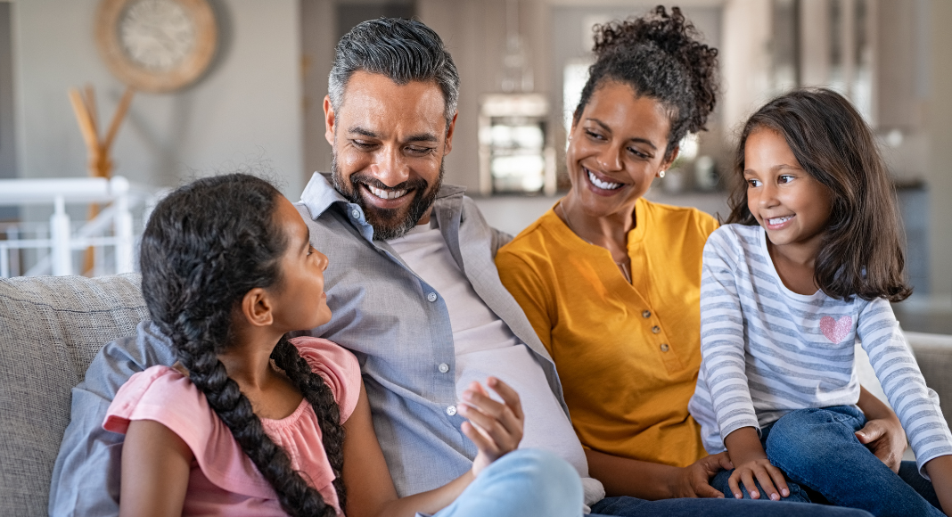 A loving family sitting together.