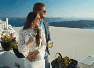 How to Avoid the Trap of Debt: Keeping up With the Joneses A rich couple drinking and holding one another.