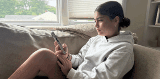 I Don’t Limit My Kids’ Screen Time A teen girl on her cell phone.