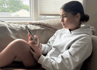 I Don’t Limit My Kids’ Screen Time A teen girl on her cell phone.