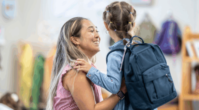 Separation Anxiety: Tips for Parents to Ensure a Smooth Drop-Off A mom saying goodbye to her daughter at school drop-off.