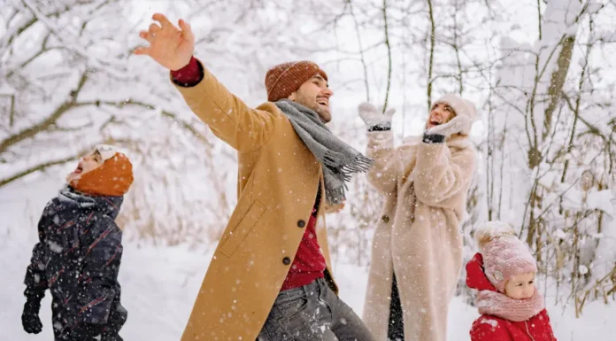 11 Unexpected Winter Getaways Near Westchester County Family playing in the snow in on a winter getaway