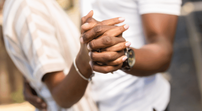Our 14th, Oops, I Mean 16th, Wedding Anniversary A couple embracing and holding hands.