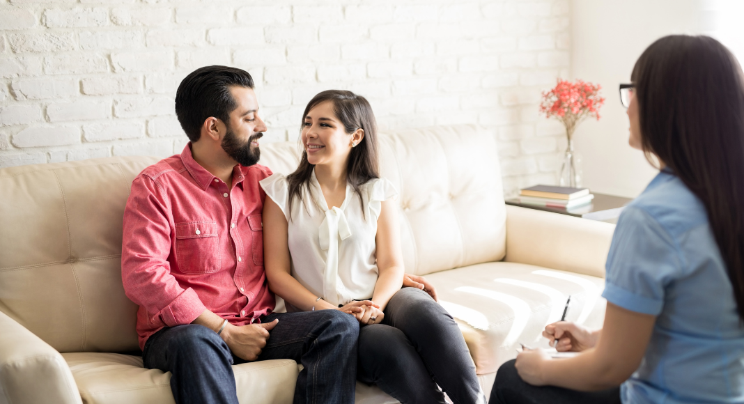 Couples in a session with a therapist. 