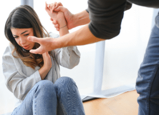 A man grabbing a woman's wrist.