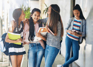The Myth of Popularity: Why It Shouldn’t Define Middle & High School A clique of girls with one girl left out.