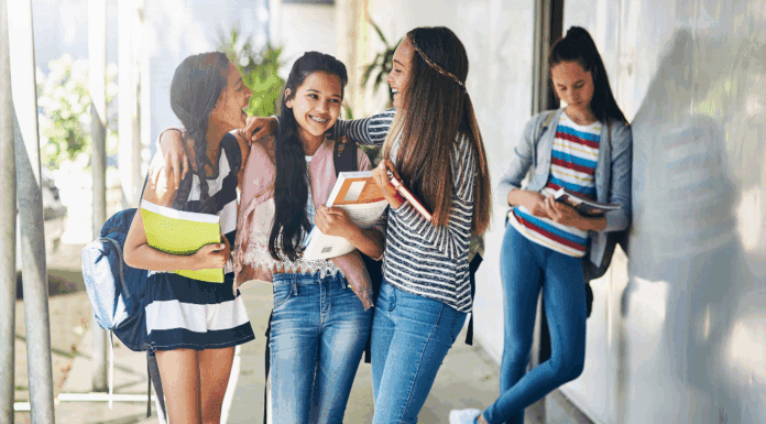 The Myth of Popularity: Why It Shouldn’t Define Middle & High School A clique of girls with one girl left out.