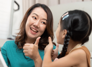 I Get to Say Yes A woman giving a thumbs up to her daughter.