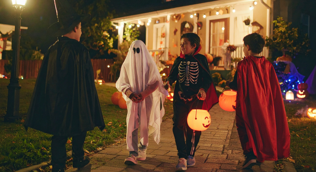 Teens trick-or-treating.