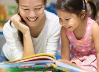 Mother and daughter reading a book at a bookstore in Westchester.