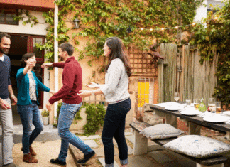 A couple greeting dinner guests.