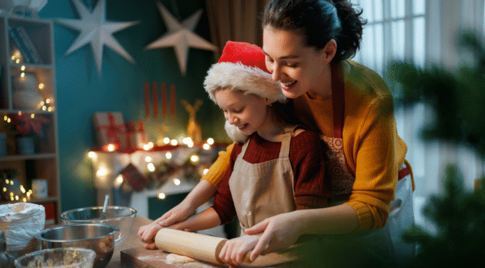 A mom and daughter rolling out Cookie dough during Christmas.
