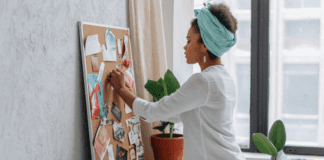 Make Your Dreams Come True A woman creating her dreams on a vision board.