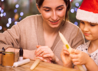 A Mon and daughter doing a holiday craft.