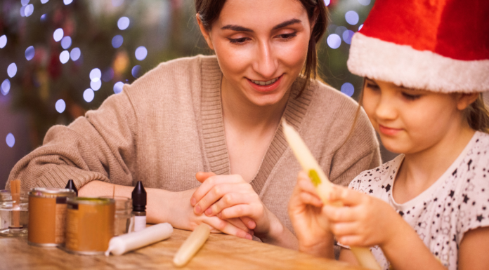 A Mon and daughter doing a holiday craft.
