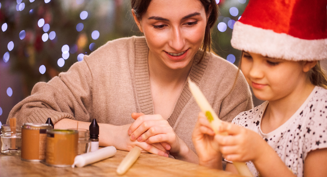 A Mon and daughter doing a holiday craft. 