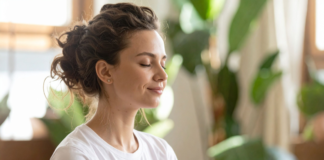 A woman being mindful and setting intentions.