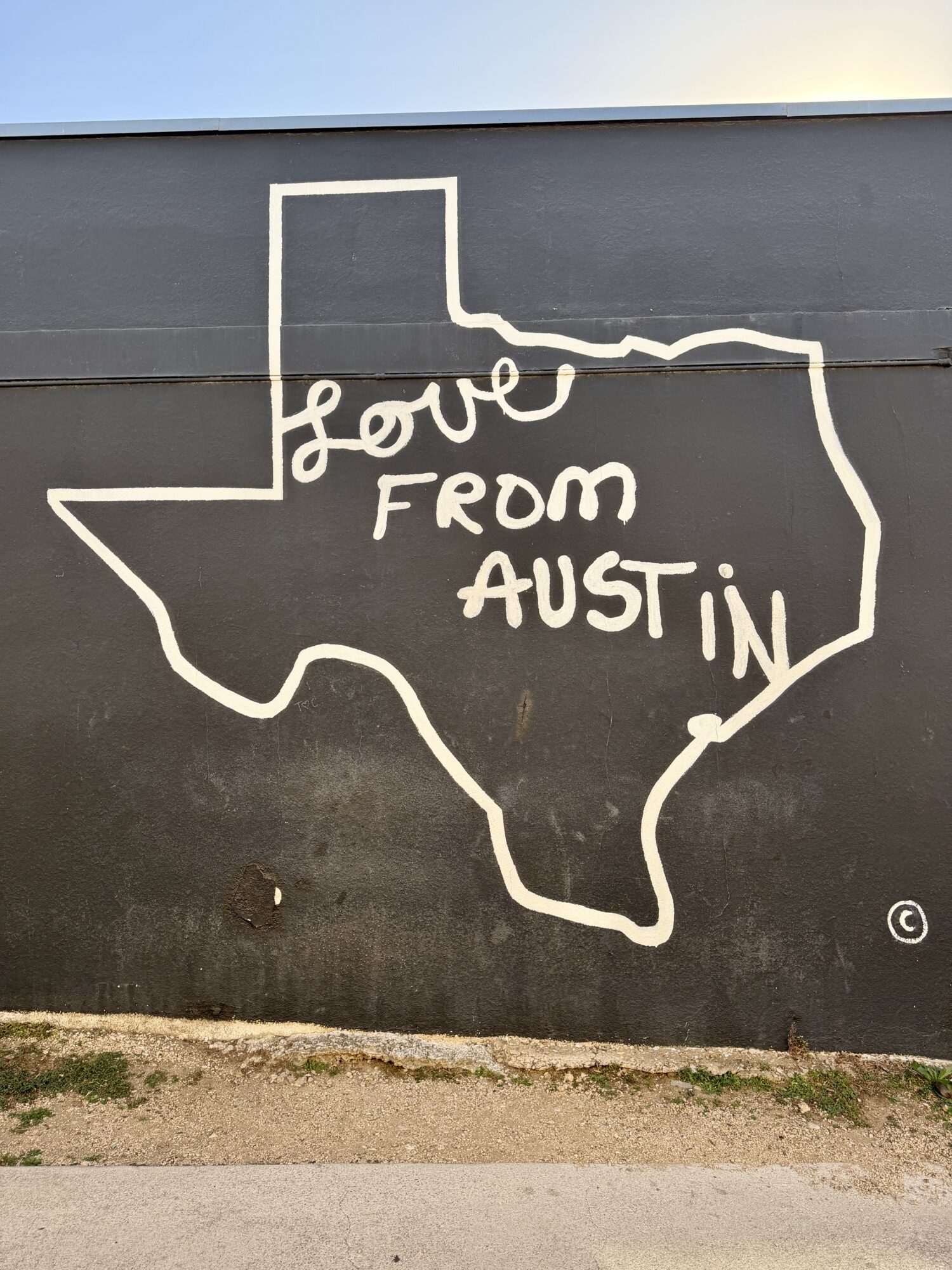 Map of Texas that Says Love From Austin on a wall in Austin