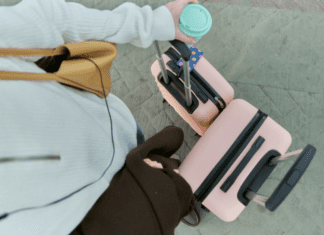 How a Chronic Over-Packer Can “Carry-On” Walking with a carry-on and travel suitcase.
