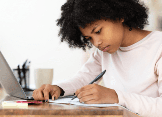 A girl writing a college essay.