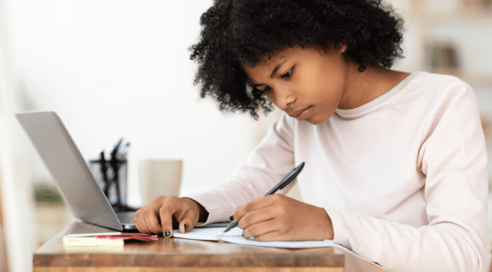 Getting a Head Start on the College Essay A girl writing a college essay.