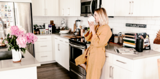Before You Reach for That Morning Cup of Joe… A woman drinking her first cup of morning coffee in the kitchen.