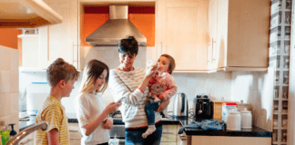 When All the Stages Collide A mom with three kids of different ages in the kitchen.