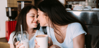 The Night That Reminded Me What Motherhood Is Really About A mom and daughter having a milkshake together.