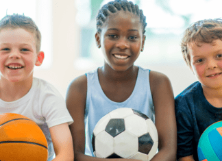 2026 Guide to Summer Camps in and Around Westchester County Kids holding sports balls for summer camp.
