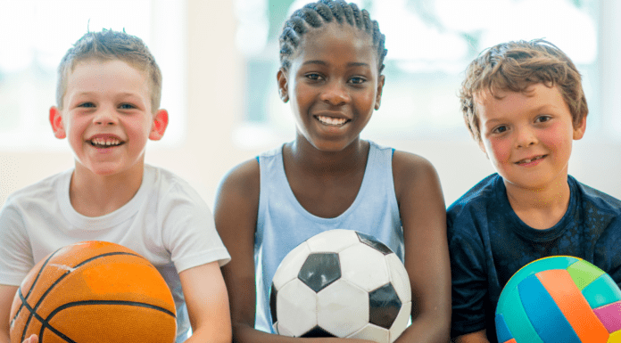 2026 Guide to Summer Camps in and Around Westchester County Kids holding sports balls for summer camp.