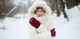 Small Ways to Beat the Winter Blues A woman bundled up outside in the middle of winter.