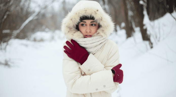Small Ways to Beat the Winter Blues A woman bundled up outside in the middle of winter.