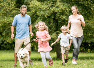 A family walking outside in the spring time.