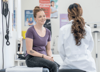 A woman consulting with a doctor.