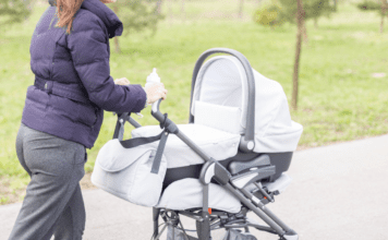 A mom pushing a stroller.