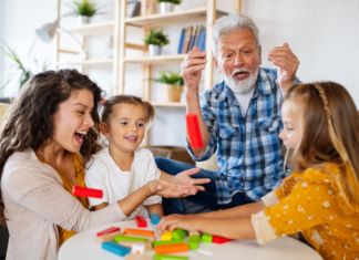 Family Traditions, I Have Few A family playing a game.
