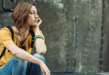 A girl sitting alone.