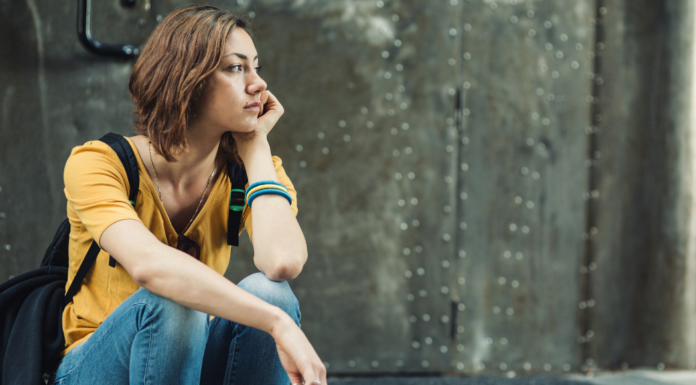 A girl sitting alone.