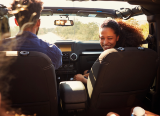 To Travel Is to Live (Even with Kids in the Backseat) A family in the car on a road trip.