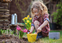 A girl planting flowers.
