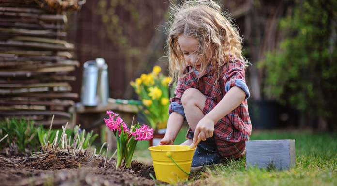 A girl planting flowers.