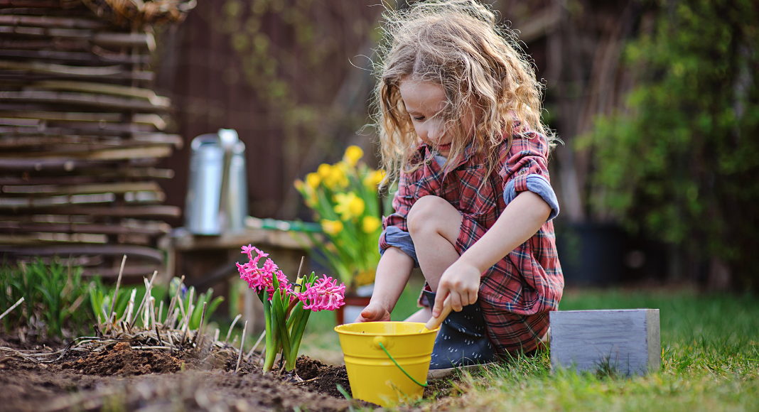 A girl planting flowers.
