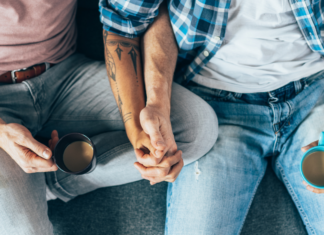 My Son Is Gay. Was I Supposed to Announce That? Gay men holding hands and drinking coffee.